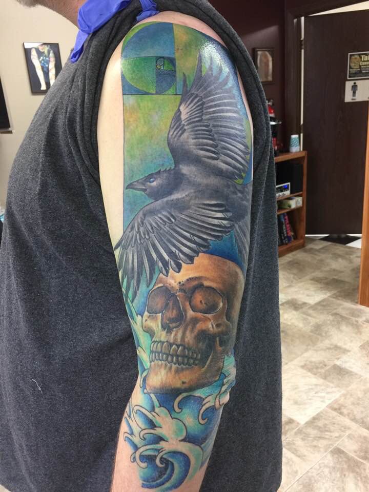 Crow and skull tattoo